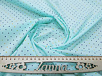 Сорочкова тканина пастельно-бірюзового кольору з дрібними кольоровими квадратиками