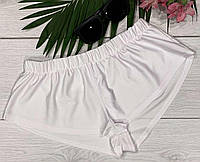 Белые женские шорты на резинке для пляжа.