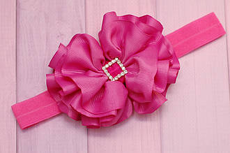 Пов'язка дитяча на голову для дівчинки малинова з об'ємним бантом на стрейтчевой основі