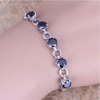 Жіночий срібний браслет з сапфіром і топазом