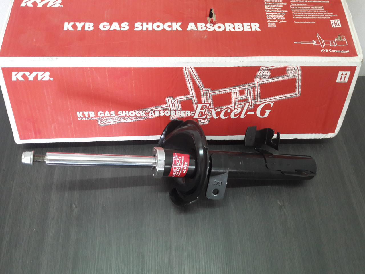 Амортизатор передній лівий KYB 334701 газ MAZDA 3 04-09