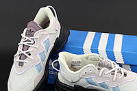 Модные кроссовки Adidas Ozweego Adiprene женские. Женские кроссы Адидас Озвиго бежевые с фиолетовым.