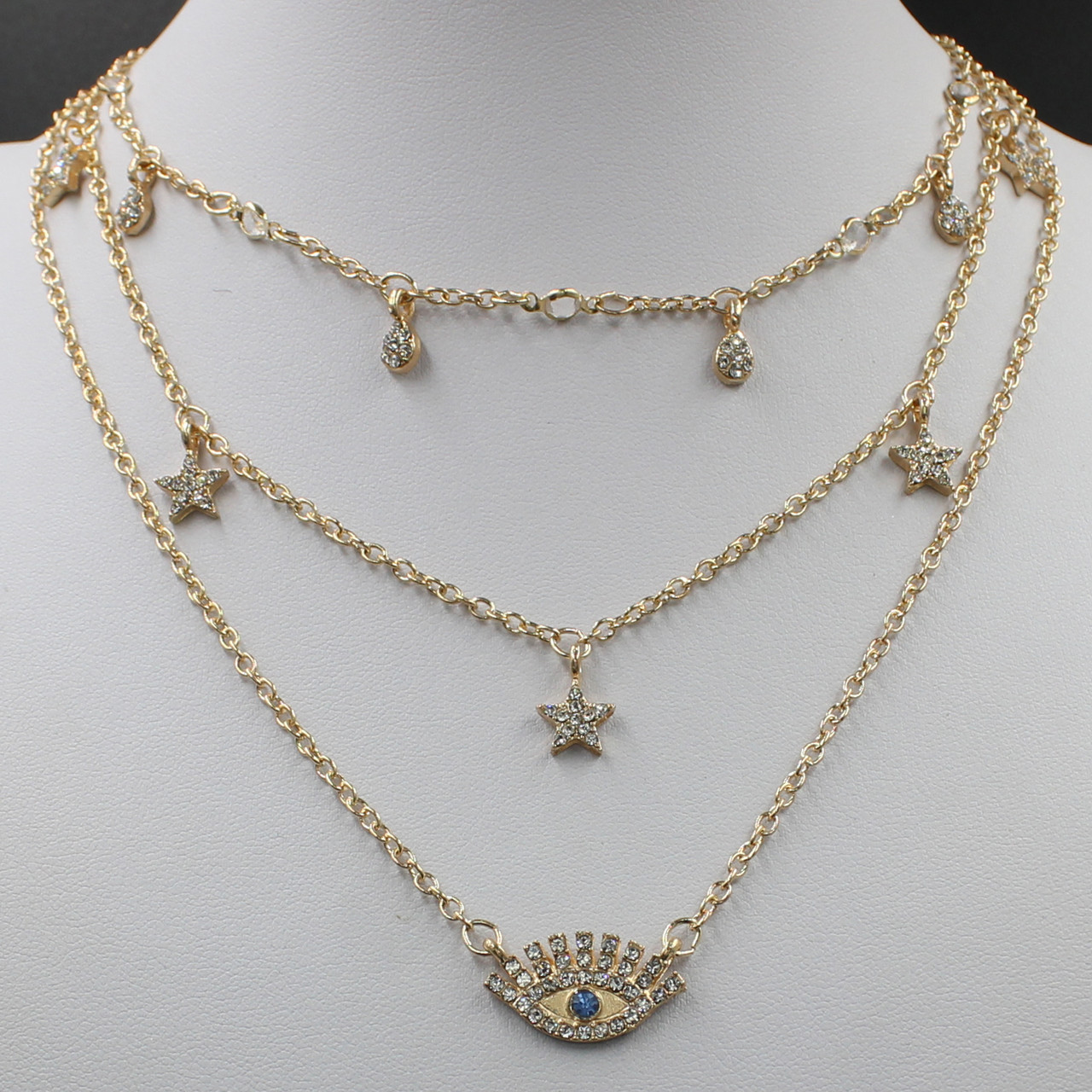 Кольє жіноче золотистого кольору багатошарове із зірочками та оком застібка карабін довжина 65 см