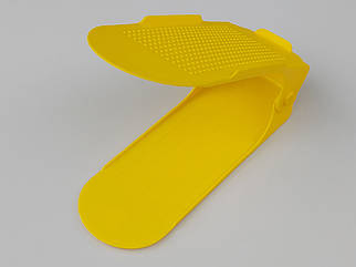 Подвійна підставка-органайзер для взуття жовтого кольору. Регулюється по висоті в 3 положеннях.