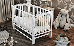 Гарне біле ліжечко для новонароджених маятник відкидний борт 120*60