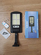 Прожектор світлодіодний на сонячній батареї Bailong BK-320-SMD з пультом і кріпленням на стіну, стовп.