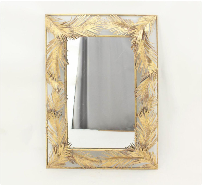 Настінне дзеркало зі скла і металу в рамі з листочками