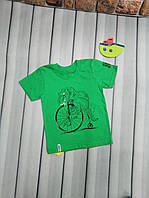 Футболка для мальчика р. 98 зеленая " Динозавр на велосипеде"