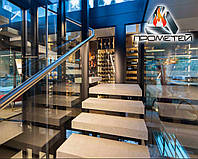 Г-образная лестница на монокосоуре с площадкой с комбинированныых материалов - в торговый центр или отель
