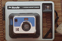 Handle a kodak instant camera