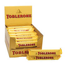 Швейцарський шоколад Toblerone c медом і мигдальною нугою. 24 плитки по 35 гр.(опт 10 шт)