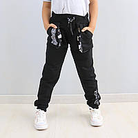 Штани чорні з кишенями для хлопчика тм Blueland розмір 122 см