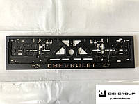 Рамка номерного знака c надписью и логотипом "Chevrolet" черная - надпись: цвета хром