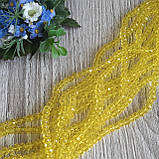 "Рондель" намистини 6 на 4 мм, прозорі жовті, 95 шт. - 22 грн, фото 2