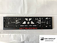 Рамка номерного знака c надписью и логотипом "Mitsubishi" черная - надпись: красного цвета.