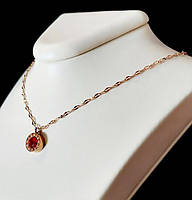 Ланцюжок Stainless Steel. Сталь. Позолота ЧВ. Камені: червоний циркон. Довжина: 39-44 см з кулоном 10 мм