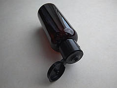 50 - 52 мл ПЕТ круглий пластиковий флакон, пластмасовий, коричневий у комплекті з кришкою фліп-топ чорного кольору.