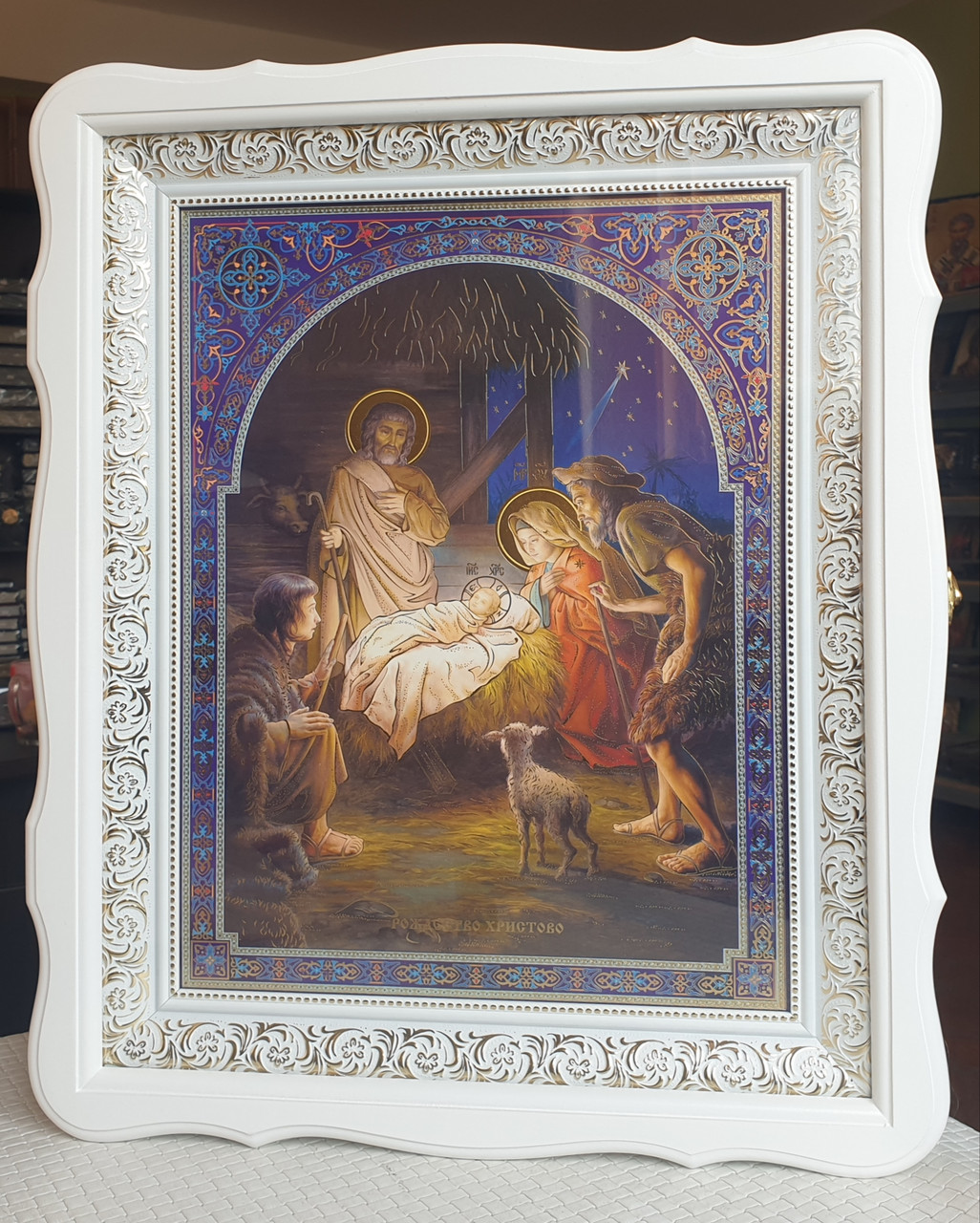 Аналойна ікона Різдво Христове двунадесяті свята у фігурному білому кіоті, розмір 52×42, лік 30*40,26 сюжетів.
