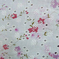 Батист білий в дірочки з рожево-бузковими квітами ш.140