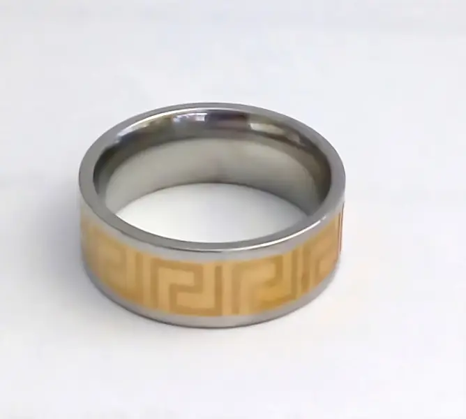 Сталева каблучка з грецьким орнаментом. Позолота 18К + родій. Є: 17р 19р