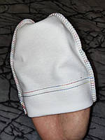 Красива молочна шапочка для новонароджених