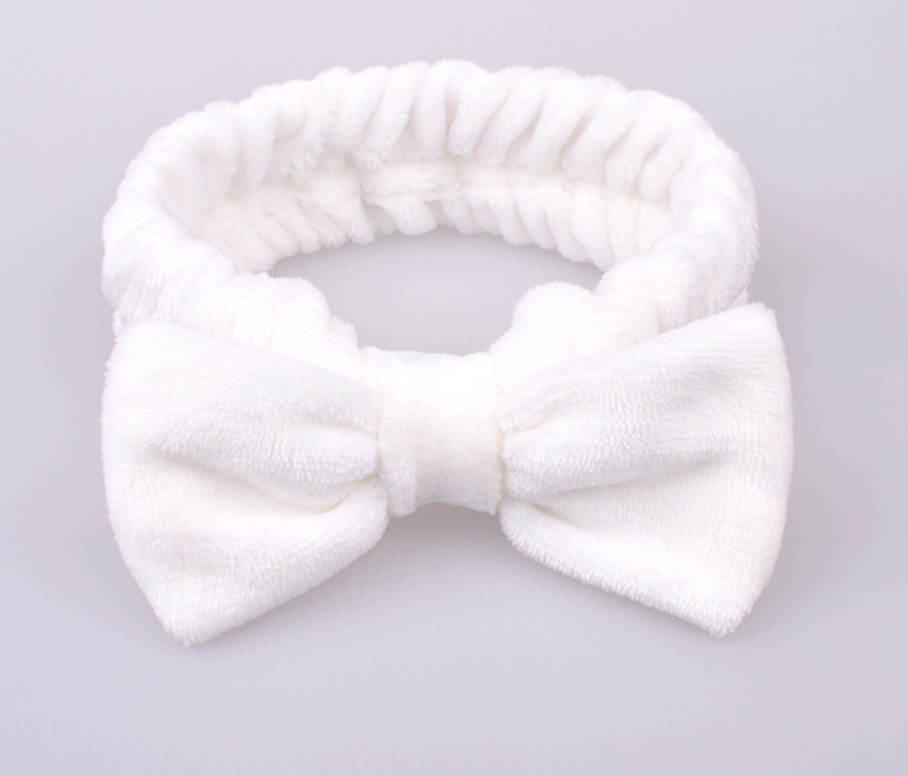 Повязка тепла на резинці з бантиком біла, фото 1