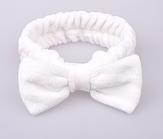 Повязка тепла на резинці з бантиком біла