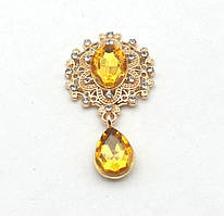 Камінь з підвісом в ажурній золотій оправі жовтий 2,6*4,6 см