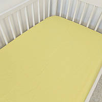 Простинка на резинці в дитяче ліжечко 120*60см жовта (Простынь на резинке в детскую кроватку жёлтая)