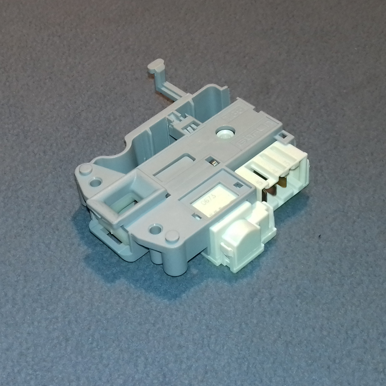 Замок люка (C00254755-1 / C00285597) для пральної машини Ariston і Indesit