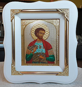 Ікона Іоанн Воїн в білому фігурному кіоті під склом з декорат. кутиками, розмір кіота 18*16, сюжет 10*12