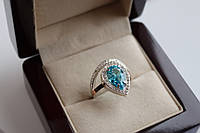 Серебряное кольцо Полина с золотыми вставками с Голубым Фианитом