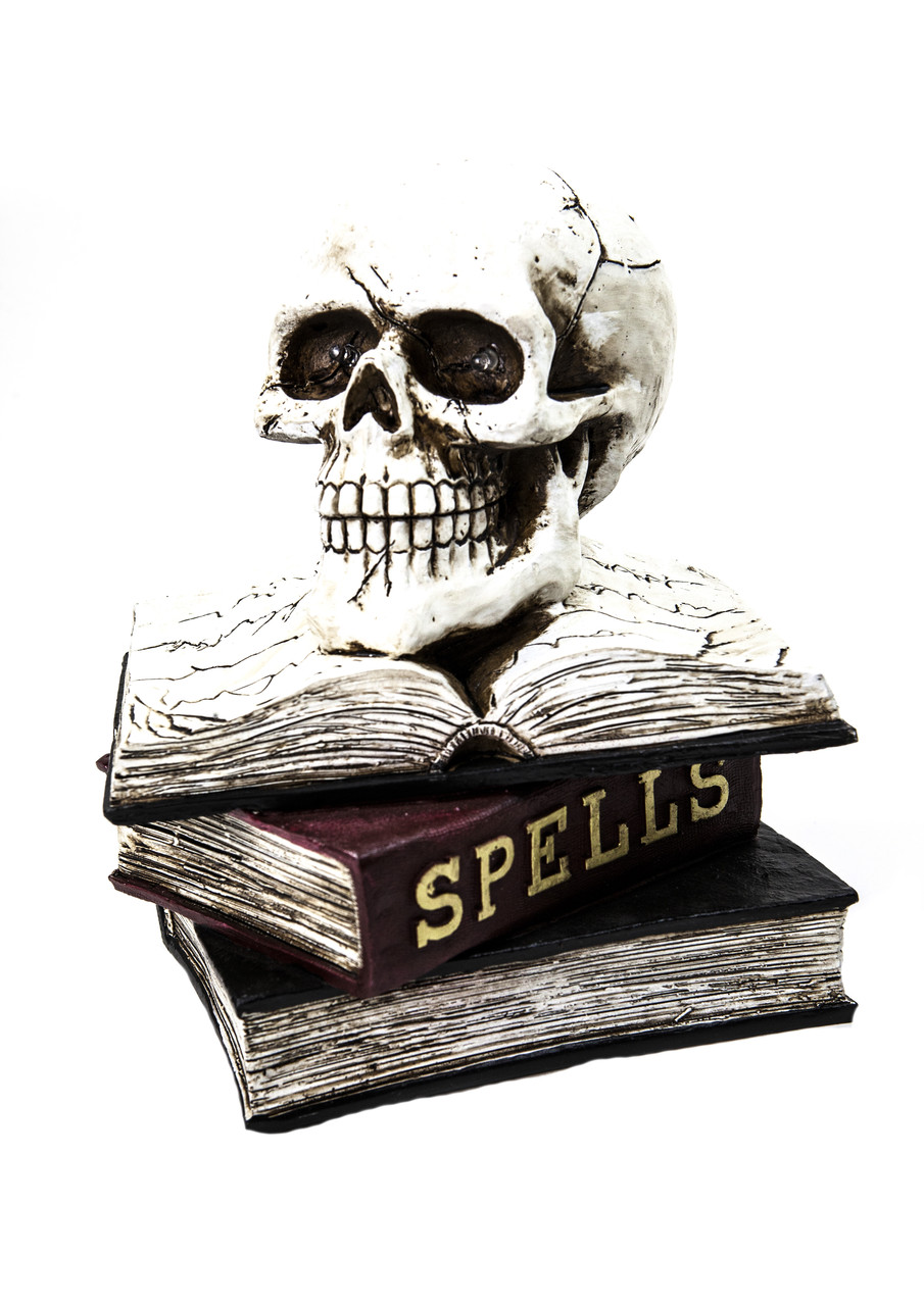 Керамічна фігура на Хеллоуїн світиться череп на книгах "Spells" 26*20 см