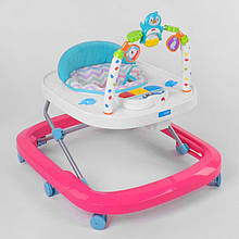 60511 Ходунки для малюків JOY рожево-білий, музична панель, брязкальця, мелодії, світло, у коробці 62 х 11