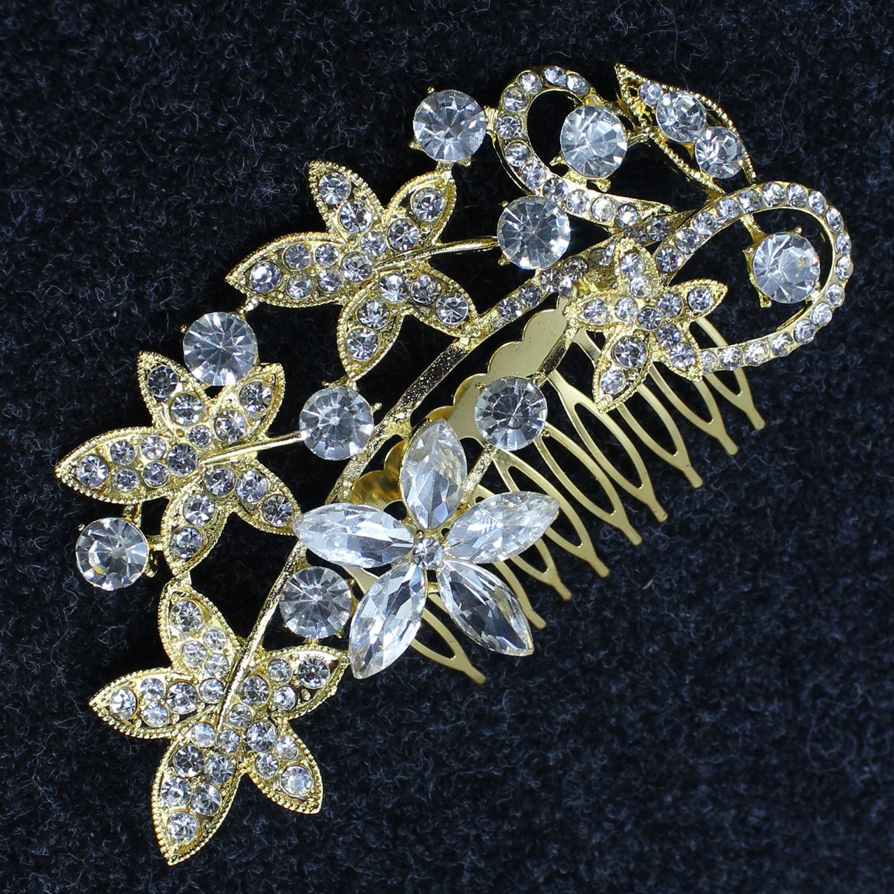 Гребінець для волосся золотистий металевий у стразах великої квіточки з листочками розмір 11х5 см на 10 зубців - фото 1 - id-p1497003240
