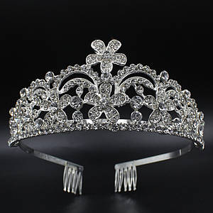 Корона діадема висота 6 см на металевій основі з гребінцями сріблястого кольору в каменях із квіточками