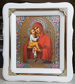 Ікона Пресвята Богородіца Почаївська в білому фігурному кіоті з декорат. куточками, розмір 24 × 21, лік 15*18.