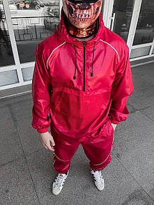 Яскравий червоний спортивний чоловічий костюм з плащівки