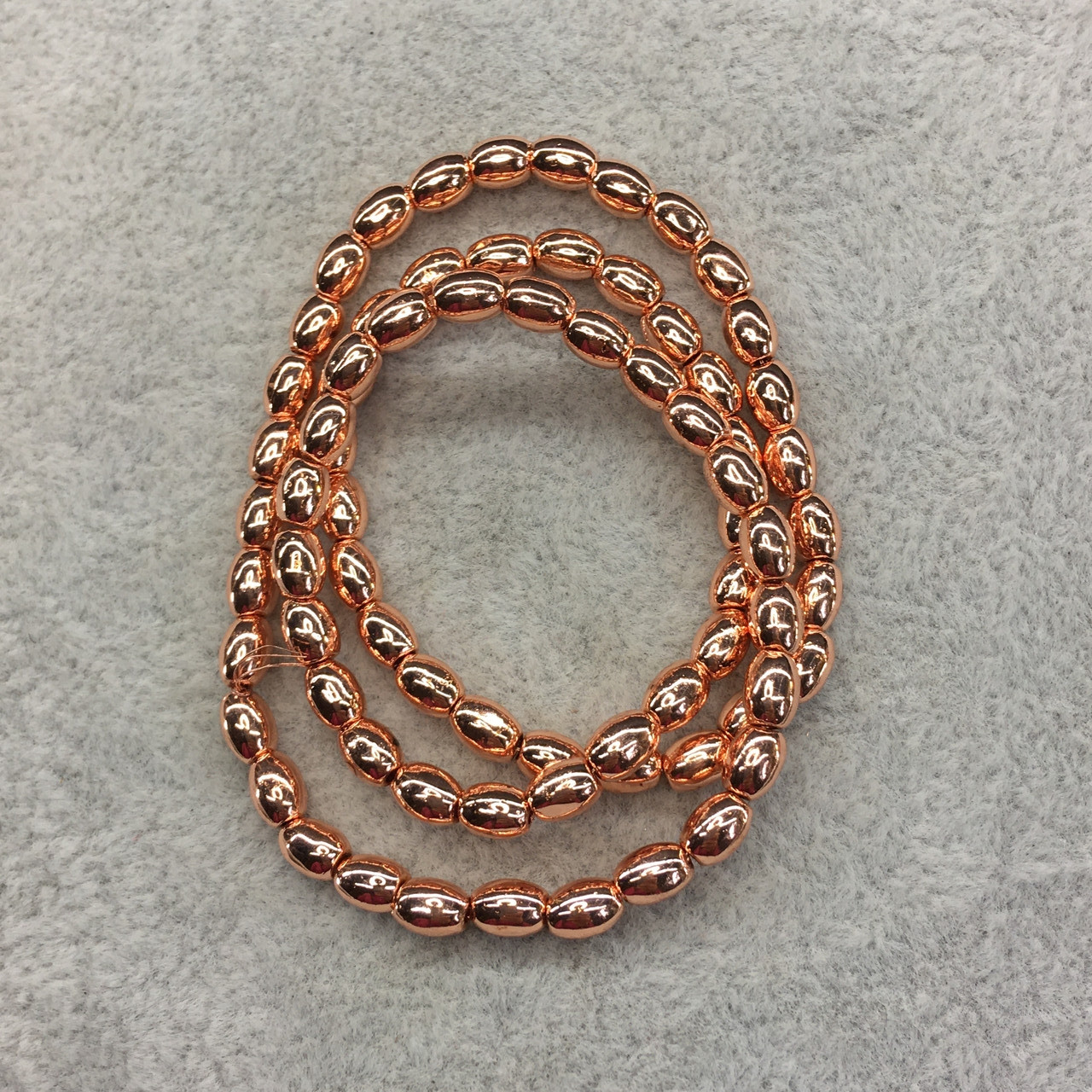 Гематит рис 4*6 мм 74 штуки колір рожеве золото, фото 1