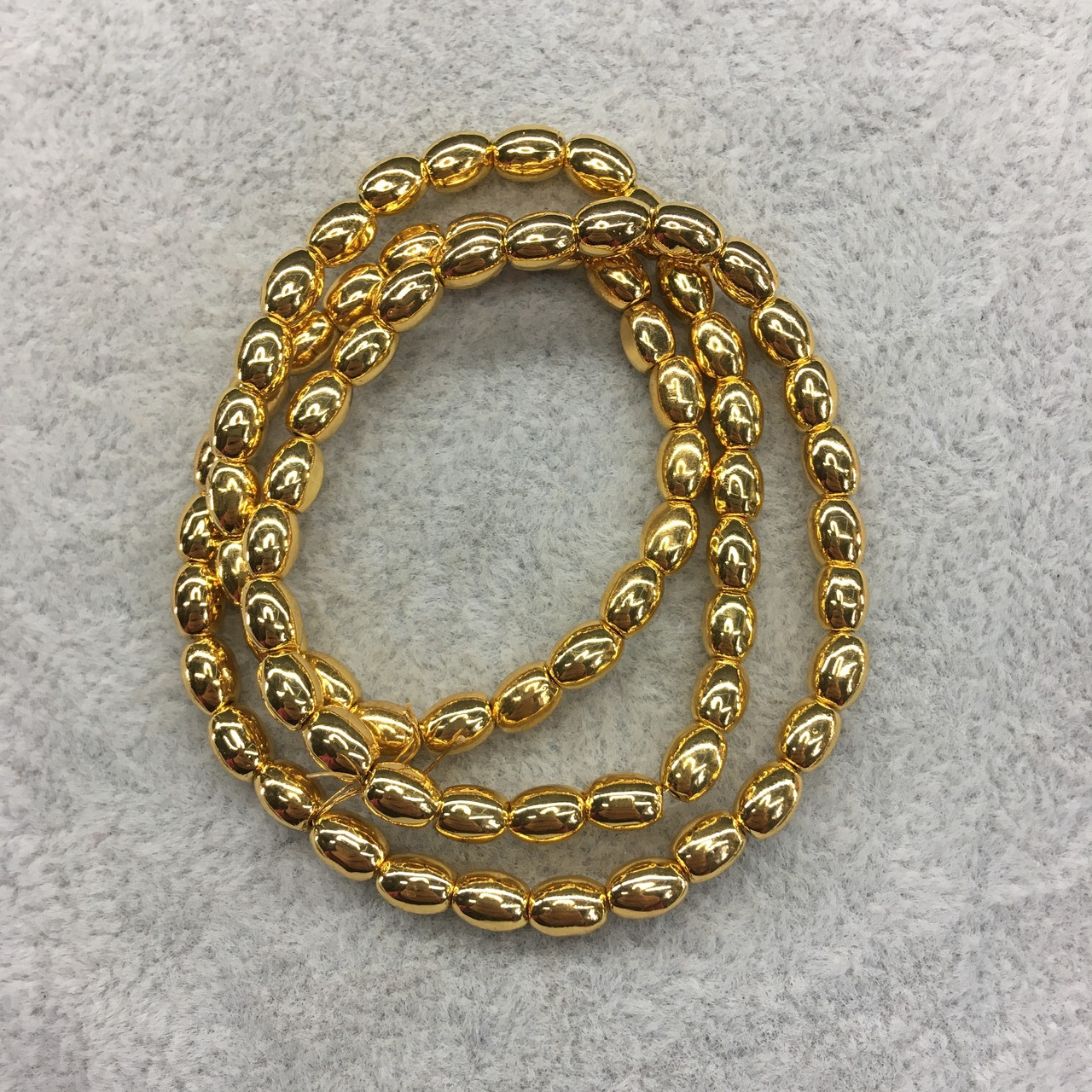 Гематит рис 4*6 мм 74 штуки колір золото, фото 1