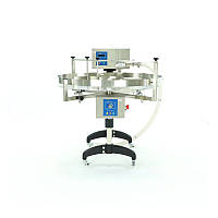 Пристрій для дозування, кремування й накачування меду зі столом обертового