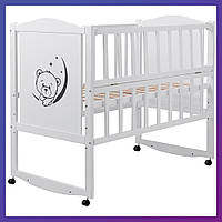 Детская кроватка деревянная из ольхи Babyroom Тедди T-01 на колесах откидной бок белая