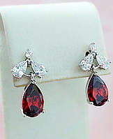 Сережки-гвоздики ХР з білими та бордовими цирконами. Родій. Довжина: 17 мм.