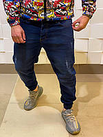 Темно-сині джинси чоловічі широкі потерті на резинці в низу