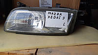 Фара Mazda Xedos 9 левая USA
