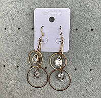 Сережки жіночі застібка петля золотистого кольору довгі висувки подвійне кільце з кристалами розмір 7 см