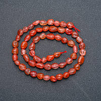 Намистини на нитці з натурального каменю Сардонікс галтівка d-8х6мм L-40см +- купити біжутерію дешево оптом в інтернеті