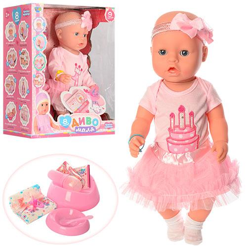 Пупс дівчинка у платті з малюнком торта та бантом на голові, фото 1