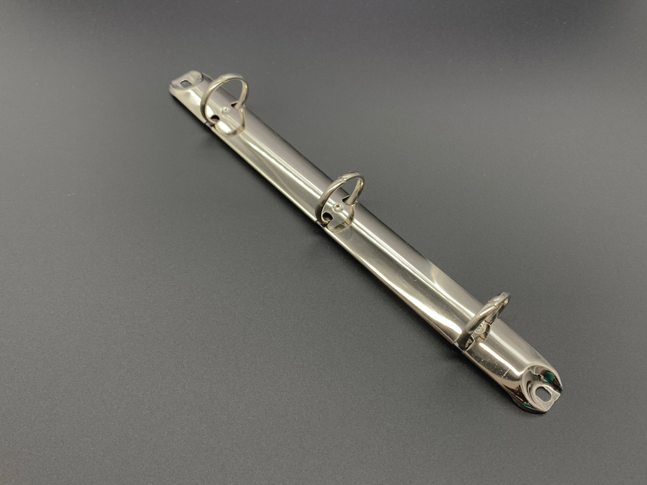 Канцелярські затискачі для блокнотів з роз'ємними ланками. 210х20мм. Кільце 21мм