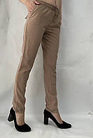 Літні жіночі штани однотонні на гумці бежеві Прямі жіночі штани великих розмірів на літо